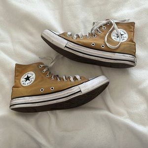 worn yellow converse